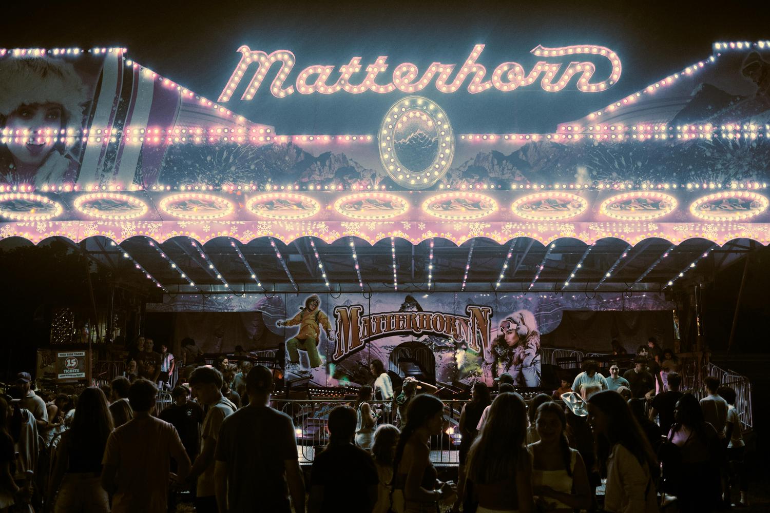 A crowd gathers in front of the 